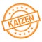 KAIZEN text written on orange vintage stamp