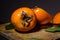 Kaki or persimmons  fruits on a old wooden background