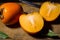 Kaki or persimmons  fruits on a old wooden background