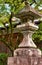 A kaku-doro  square stone lantern in the Japanese shrine. Kyoto. Japan