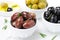 Kalamata olives, black and green olives, rosemary and olive oil