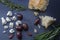 Kalamata olives and feta cheese with bread and herbs on a dark b