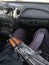 A Kalashnikov assault rifle lies on the lap of a policeman