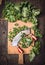Kale chopping on cutting board and old mincing knife