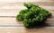 Kale placed against a wooden background