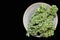 Kale on Plate over Black Overhead View