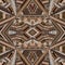 Kaleidoscope made of brown tones ethnic patchwork fabric