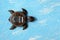 Kalimba turtle on a blue background. Traditional instrument from Africa in close-up. Copy space