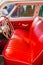 Kaliningrad, Russia - August 22, 2019. Vintage Volga car, Gaz 21, steering wheel with an emblem, inside interior appearance, red