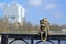 KALININGRAD, RUSSIA.The bronze figure of the grandfather-homlin sits against the background of the House of Soviets