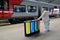 KALININGRAD, RUSSIA. The man puts garbage in a c container for separate collecting. Southern station. The Russian text - plastic,