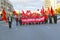 KALININGRAD, RUSSIA. People carry a placard reading `Glory to the Great October!` at the head of a march commemorating the 100th