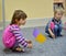 KALININGRAD, RUSSIA. Small children play with tags, sitting on a floor. Kindergarten