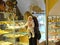 KALININGRAD, RUSSIA. The woman with the chilld chooses amber jewelry in shop of the museum of amber