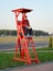 KALININGRAD, RUSSIA. The youth volunteer with the megaphone in a hand sits on a tower. Territory of Baltic Arena stadium. The FIFA