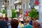 Kaluga city, Russia - May 2019: little girl wearing forage-cap seats on shoulders of her father and participates in parade.