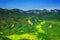 Kamchatka. Wild nature. Green fields and volcanoes. View from the helicopter.