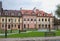 Kamenets-Podolsk city, central place, restored houses in a modern style, green lawns and benches