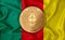 kamerun flag  ethereum gold coin on flag background. The concept of blockchain  bitcoin  currency decentralization in the country