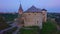 The Kamianets-Podilskyi Castle against the twilight sky, Ukraine