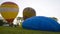 KAMIANETS-PODOLSKYI, UKRAINE, 17.05.2019 4K multicolored balloon inflating in the blue sky. Ukraine