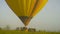 KAMIANETS-PODOLSKYI, UKRAINE, 17.05.2019 takeoff air balloon at sunset , air balloons start fly from grass field at