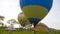 KAMIANETS-PODOLSKYI, UKRAINE, 17.05.2019People inflate a balloon, men inflate a hot air balloon. The balloon begins to