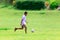 KANCHANABURI, Thailand -AUGUST 25, 2017: Slow motion of the Thai student playing football on green field in the school