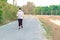 KANCHANABURI/THAILAND-MAY 7,2020 : Unidentified Thai sportive woman must wears protective mask on face jogging for good health due