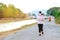 KANCHANABURI/THAILAND-MAY 7,2020 : Unidentified Thai sportive woman must wears protective mask on face jogging for good health due