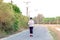 KANCHANABURI/THAILAND-MAY 7,2020 : Unidentified Thai sportive woman must wears protective mask on face jogging for good health due