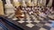 Kandy, Sri Lanka - 09-03-24 - monk leads dozens of people sitting on floor in prayer 1 - facing monk