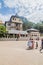 KANDY, SRI LANKA - JULY 19, 2016: Mostly white clothed Buddhist devotees in front ofTemple of the Sacred Tooth Relic