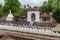 KANDY, SRI LANKA - JULY 19, 2016: White clothed Buddhist devotees at the grounds of the Temple of Sacred Tooth Relic