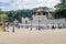 KANDY, SRI LANKA - JULY 19, 2016: White clothed Buddhist devotees visit Temple of the Sacred Tooth Relic during Poya