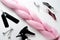 Kanekalon pink hair light pink on white background top view close clips a comb and the spray