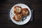 Kanelbulle Cinnamon buns with buttercream on a rustic wooden table. Homemade fresh pastries