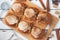 Kanelbulle Cinnamon buns with buttercream on a rustic wooden table. Homemade fresh pastries