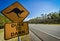 Kangaroo road sign next to a highway, Australia