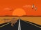 The kangaroo is running on a long road in the desert, with sunsets background