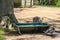 Kangaroo sits water out of a metal tough while bird grooms itself in foreground - selective focus