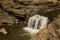 Kanger dhara waterfalls plunges from rocky terrece