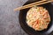 Kani salad is a Japanese style seafood salad made with crab stick closeup in the plate. Horizontal top view