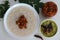 Kanji and Kadumanga. Rice gruel prepared with Kerala Matta rice. Served with raw banana curry and Kerala style cut mango pickle