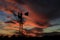 Kansas Awesome Sunset with colorful clouds, and a farm Windmill silhouette .