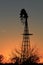 Kansas Awesome Sunset with colorful clouds, and a farm Windmill silhouette .