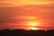 Kansas Blazing Orange Sunset with clouds and the Sun