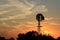 Kansas colorful Sunset with yellow and orange sky with a Windmill silhouette