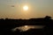 Kansas Smokey Sunset with a colorful sky and pond.