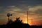 Kansas Windmill at Sunset with a colorful sky with the Sun